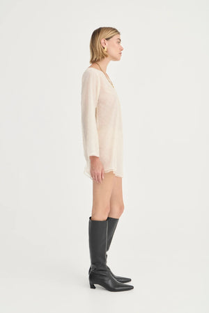 The Eloise Beaded Mini Ivory by Solaqua – sheer beaded mini dress with off shoulder neckline and oversized fit.
