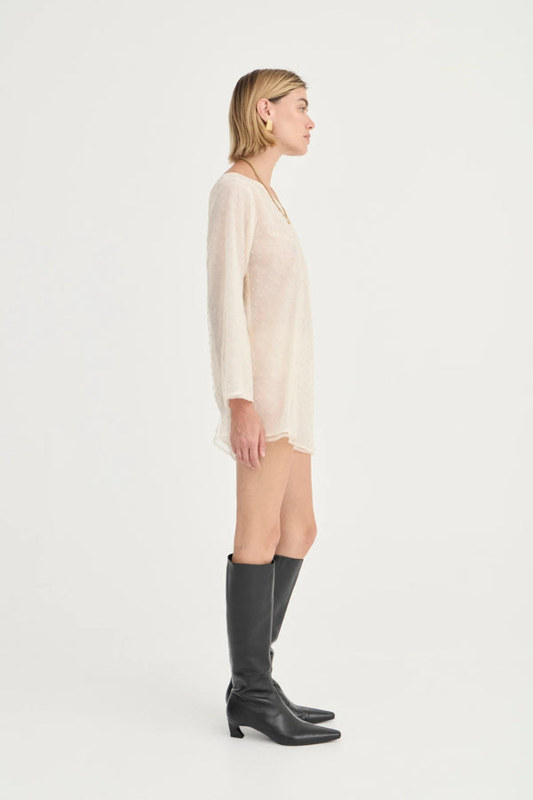 The Eloise Beaded Mini Ivory by Solaqua – sheer beaded mini dress with off shoulder neckline and oversized fit.