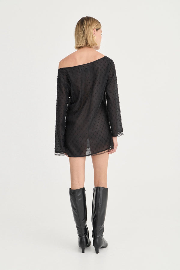 The Eloise Beaded Mini Noir by Solaqua – sheer beaded mini dress with off shoulder neckline and oversized fit.
