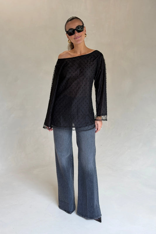 The Eloise Beaded Mini Noir by Solaqua – sheer beaded mini dress with off shoulder neckline and oversized fit.