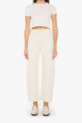 The Half-Pipe in Act Natural by MOTHER, high-waisted cream jeans with wide curved legs, tonal hardware, and a clean minimal finish.