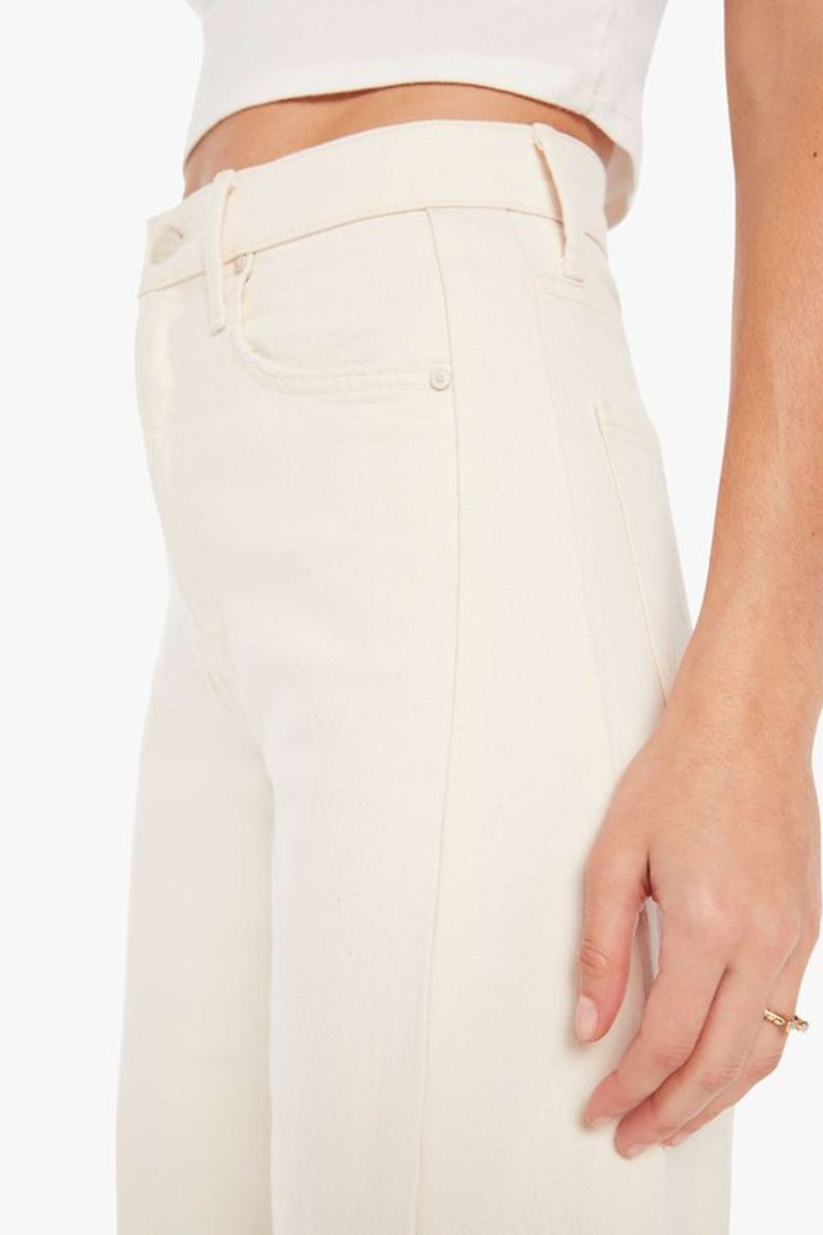 The Half-Pipe in Act Natural by MOTHER, high-waisted cream jeans with wide curved legs, tonal hardware, and a clean minimal finish.