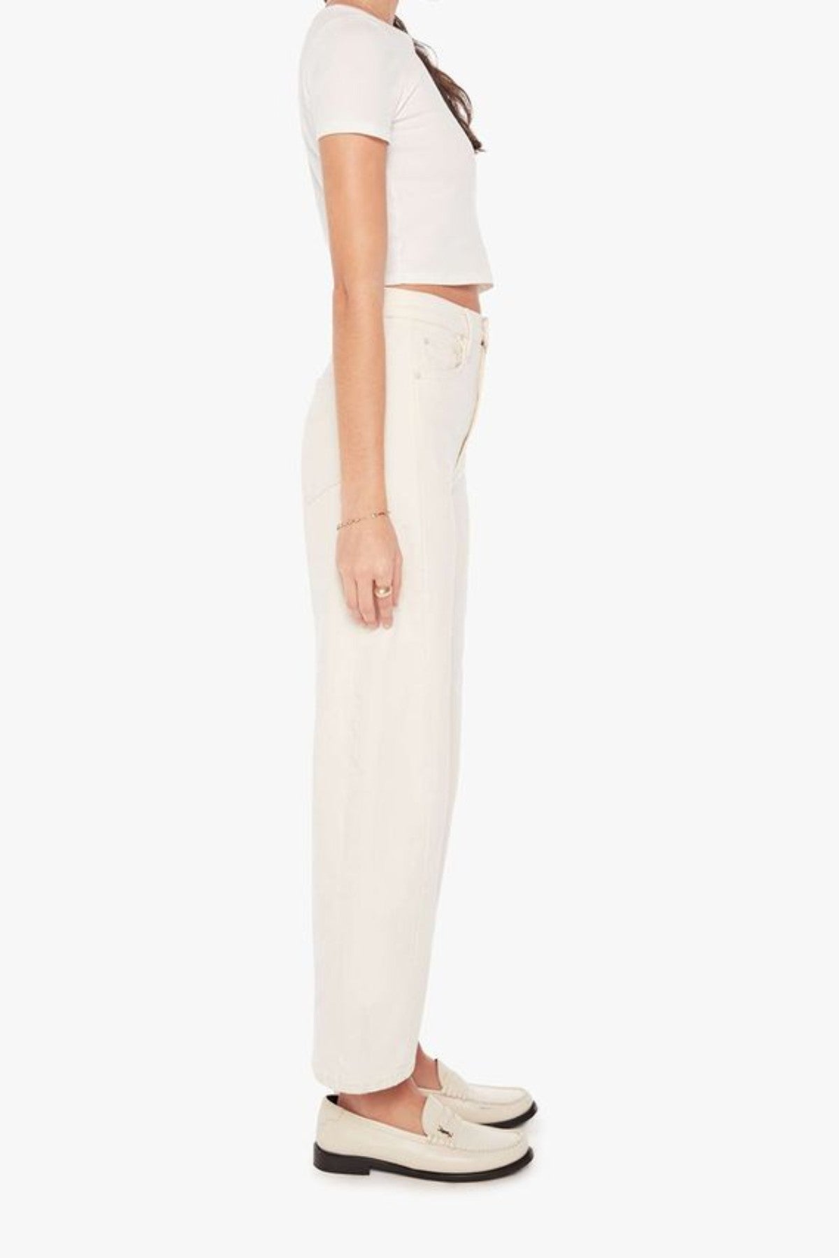 The Half-Pipe in Act Natural by MOTHER, high-waisted cream jeans with wide curved legs, tonal hardware, and a clean minimal finish.