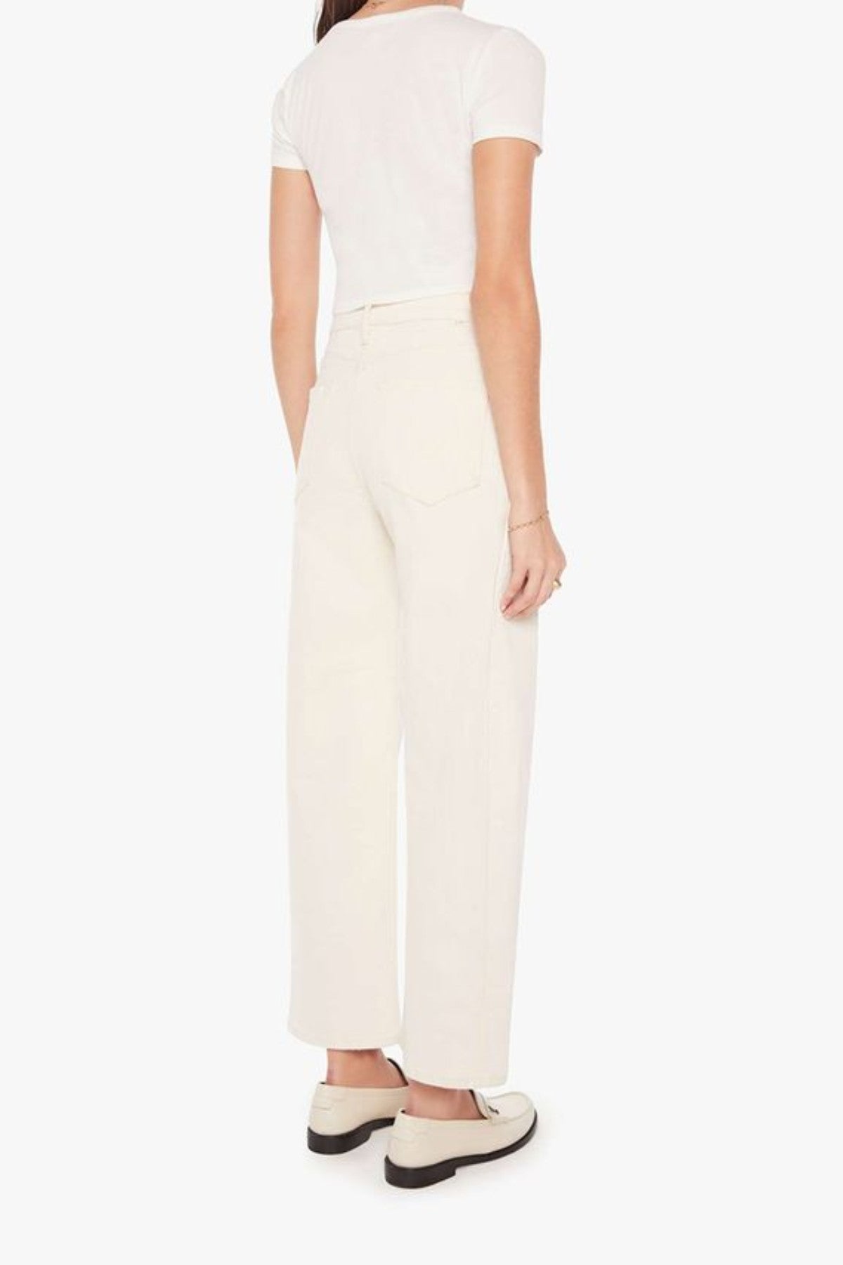 The Half-Pipe in Act Natural by MOTHER, high-waisted cream jeans with wide curved legs, tonal hardware, and a clean minimal finish.