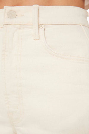 The Half-Pipe in Act Natural by MOTHER, high-waisted cream jeans with wide curved legs, tonal hardware, and a clean minimal finish.