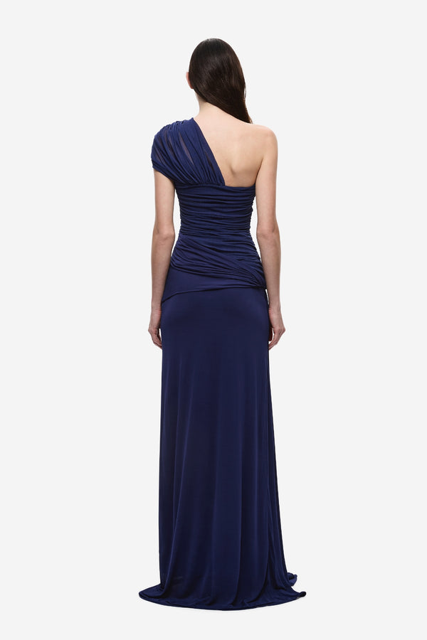The Interwoven Maxi Dress Deep Blue by Misha – one shoulder silk tulle maxi dress with ruched waist and waterfall sash.