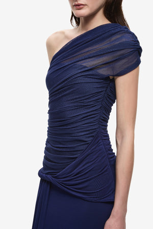 The Interwoven Maxi Dress Deep Blue by Misha – one shoulder silk tulle maxi dress with ruched waist and waterfall sash.
