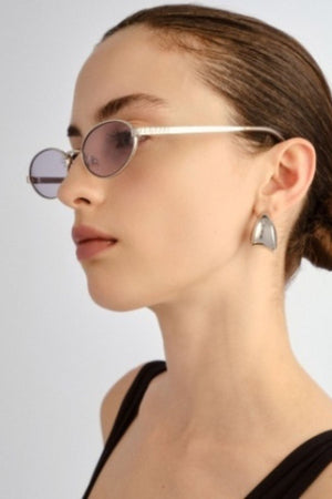 The Kendall Silver by Luv Lou - small oval sunglasses with silver metal frame and smoke lenses, perfect for refined everyday styling.