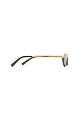 The Lia sunglasses by Luv Lou, black cat-eye frame with metal accents and debossed Organic L pattern, featuring smoke mono lenses.