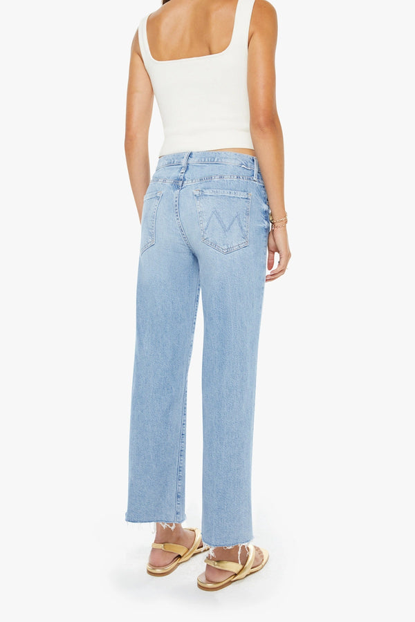 The Mid Rise Rambler Zip Ankle Fray Comeback Kid by MOTHER – mid rise straight leg jeans with frayed hem and faded wash.