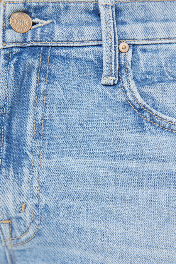 The Mid Rise Rambler Zip Ankle Fray Comeback Kid by MOTHER – mid rise straight leg jeans with frayed hem and faded wash.
