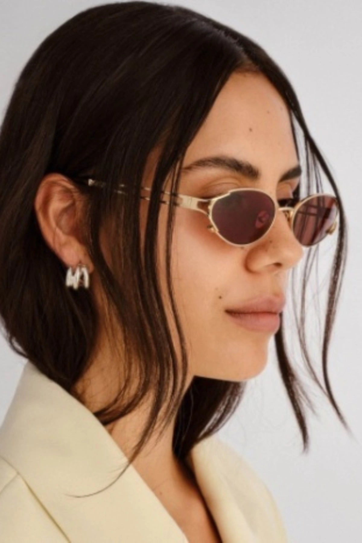 Paloma in Gold by Luv Lou, vintage-inspired oval sunglasses with split temples, brown mono CR39 lenses, and debossed hinge.