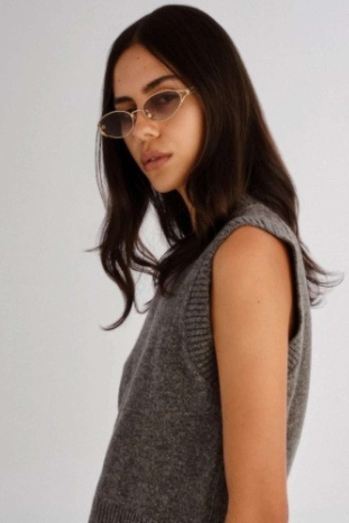 Paloma in Light Gold by Luv Lou, vintage-inspired oval sunglasses with split temples, charcoal gradient CR39 lenses, and debossed hinge.