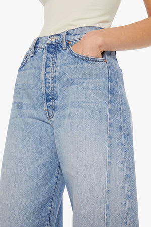 The Pipe Dream Button Sneak High Rise Jeans in Leap At The Chance by MOTHER, bold barrel-leg denim with contrast stitching and side insets for a structured, statement fit.