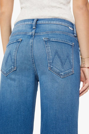 The Rerun Sneak Kissing The Caddy by MOTHER, wide leg denim with high rise fit and faded blue wash, relaxed everyday jeans for casual styling.