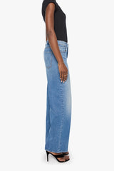 The Rerun Zip Skimp Just An Animal by MOTHER – high rise wide leg jeans in blue denim. Perfect for everyday styling.