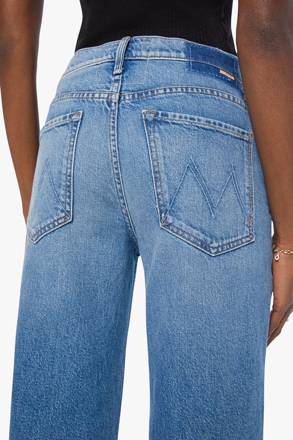The Rerun Zip Skimp Just An Animal by MOTHER – high rise wide leg jeans in blue denim. Perfect for everyday styling.