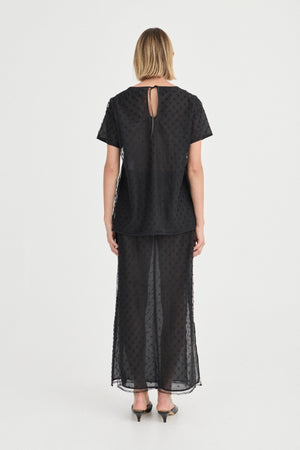 The Saasha Beaded Skirt Noir by Solaqua – sheer beaded maxi skirt with side split and fluid silhouette.
