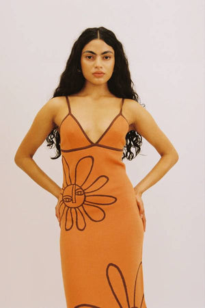 The Wolf Gang Soleil Knit Midi Dress in Jaffa, a form-fitting intarsia knit midi with floral motifs, V-scoop neckline, contrast straps, and low back.