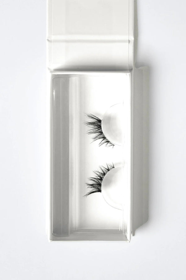 Three Fourths Lash 0.4 by OWN Beauty Essentials – feathered corner lashes with soft volume and lifted outer lash effect.