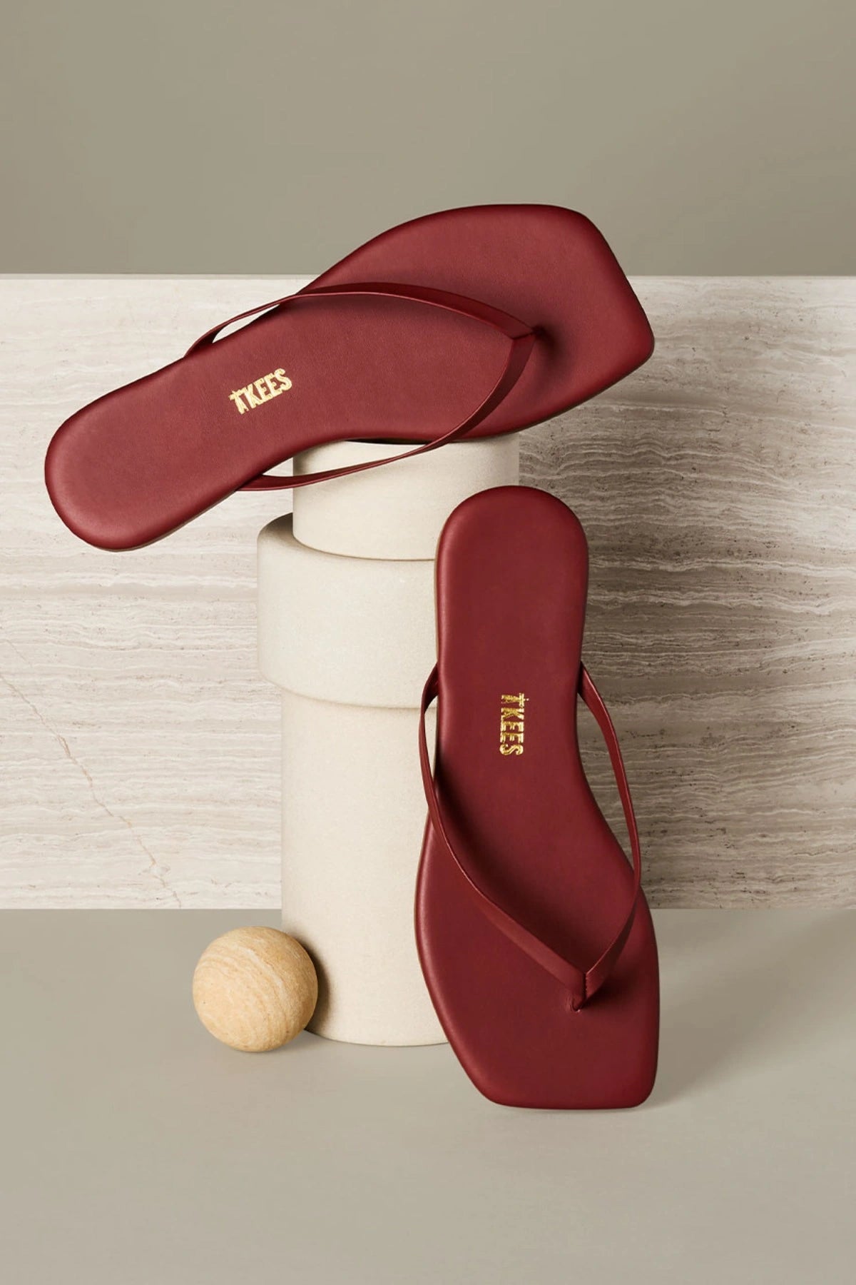 Tkees red suede sandal with clean modern lines, leather insole, and square-toe silhouette, handcrafted in Brazil.
