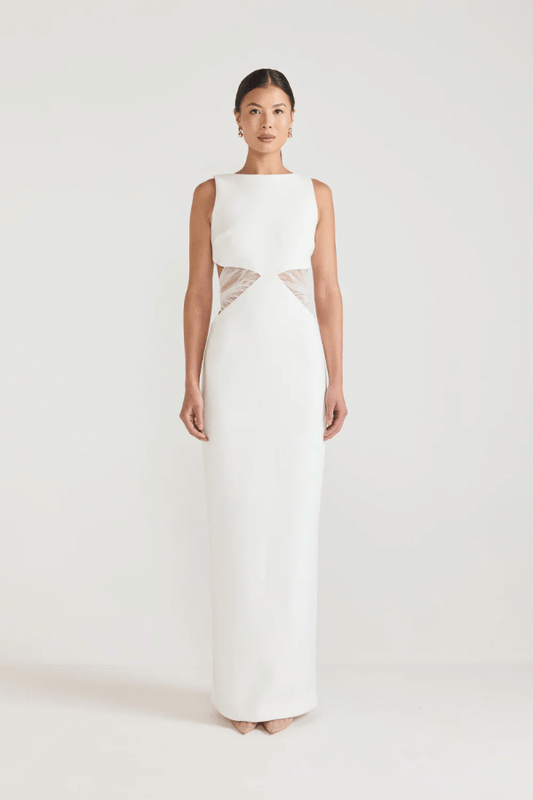 Bellina Dress Black by Tojhà, a sculptural crepe maxi with waist cut-out and mesh tie detail. Perfect for striking modern evening looks.