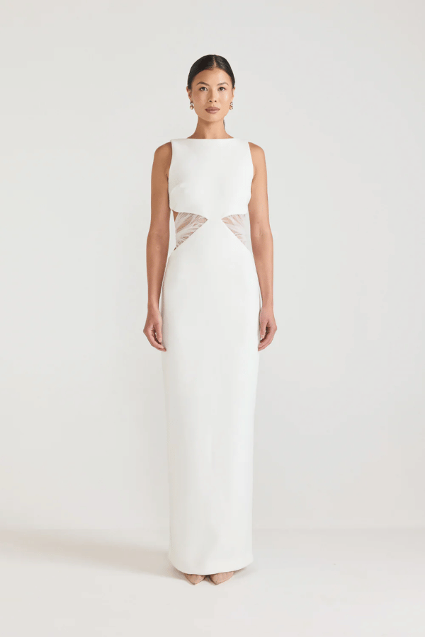 Bellina Dress Black by Tojhà, a sculptural crepe maxi with waist cut-out and mesh tie detail. Perfect for striking modern evening looks.