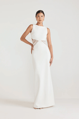 Bellina Dress Black by Tojhà, a sculptural crepe maxi with waist cut-out and mesh tie detail. Perfect for striking modern evening looks.
