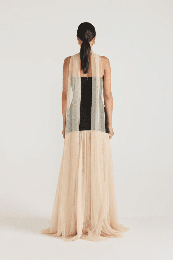 Strapless Maxi Gown Black by Tojhà, a bold crepe silhouette with sheer mesh skirt and ruffle neckline. Perfect for standout formal events.