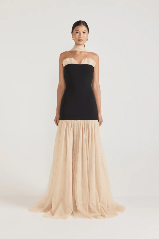 Strapless Maxi Gown Black by Tojhà, a bold crepe silhouette with sheer mesh skirt and ruffle neckline. Perfect for standout formal events.