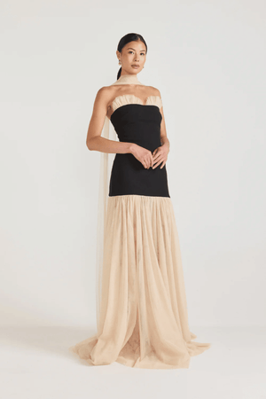 Strapless Maxi Gown Black by Tojhà, a bold crepe silhouette with sheer mesh skirt and ruffle neckline. Perfect for standout formal events.