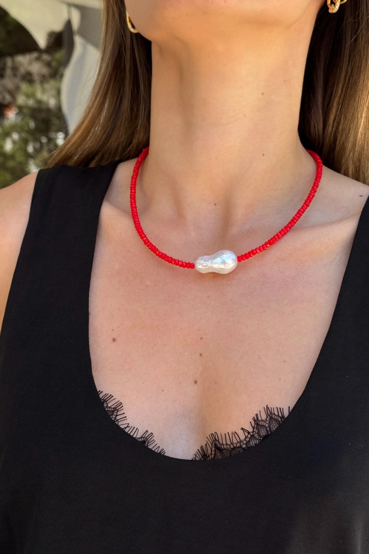 Toledo Necklace by Amber Sceats, handcrafted in Italy with red crystals, baroque freshwater pearl, and 24K gold plating for bold elegance.