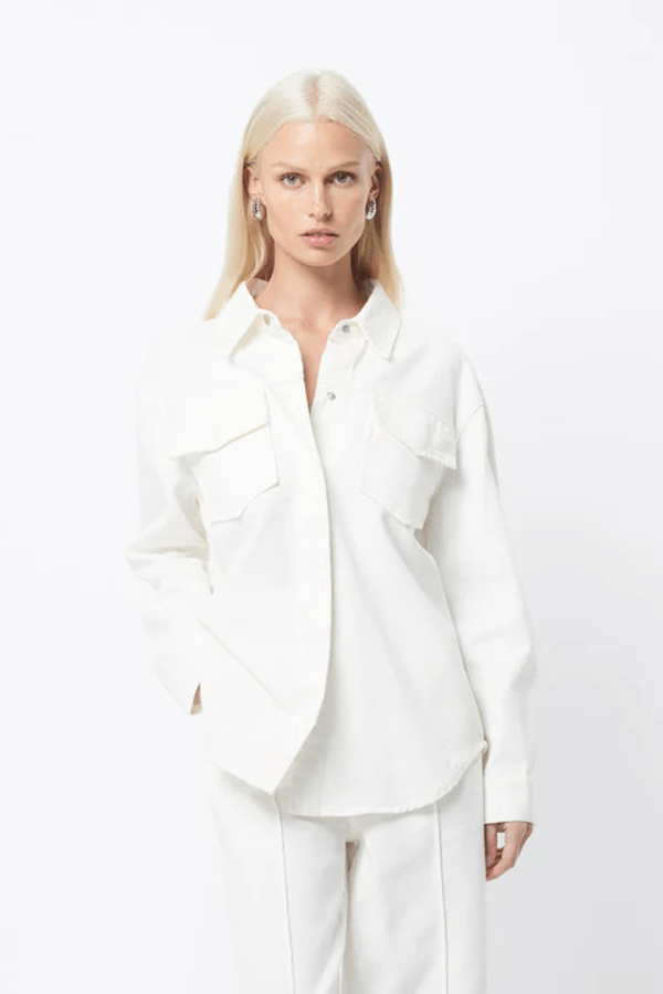 Transpire Shirt White by Mossman – a relaxed cotton shirt with patch pockets and curved hem. Perfect for casual styling.
