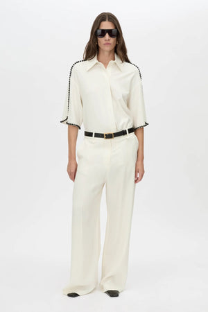 Trevi Shirt by in Cream Camilla and Marc – a cream short-sleeve shirt with hand-sewn bead details and clean tailoring, perfect for polished warm days.
