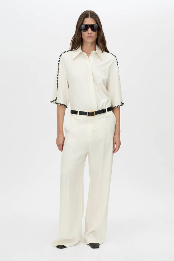 Trevi Shirt by in Cream Camilla and Marc – a cream short-sleeve shirt with hand-sewn bead details and clean tailoring, perfect for polished warm days.
