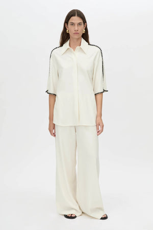 Trevi Shirt by in Cream Camilla and Marc – a cream short-sleeve shirt with hand-sewn bead details and clean tailoring, perfect for polished warm days.