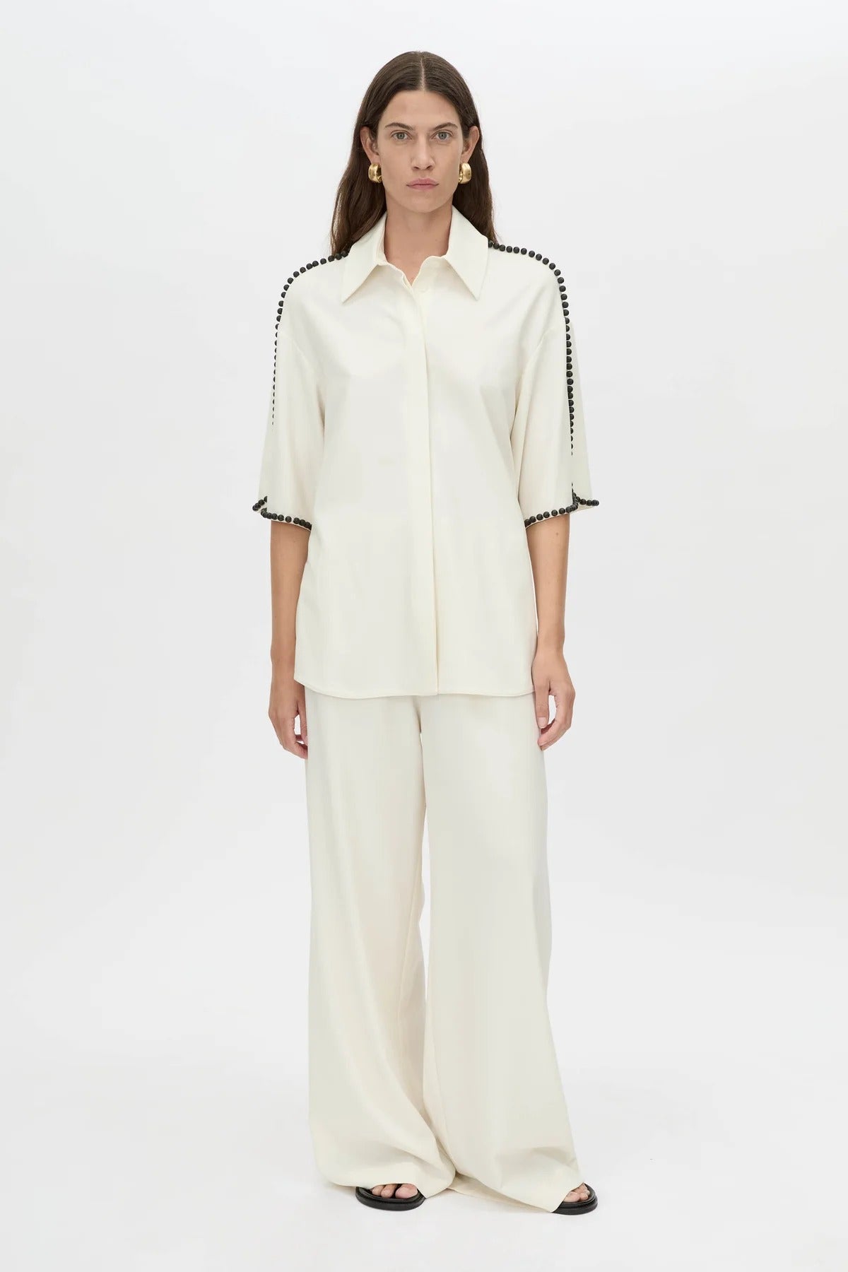 Trevi Shirt by in Cream Camilla and Marc – a cream short-sleeve shirt with hand-sewn bead details and clean tailoring, perfect for polished warm days.