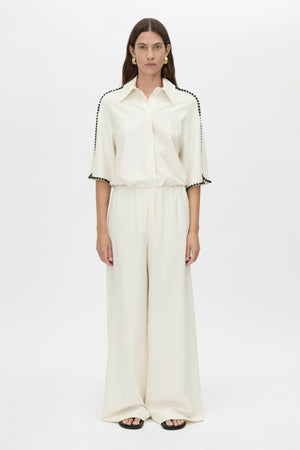 Trevi Shirt by in Cream Camilla and Marc – a cream short-sleeve shirt with hand-sewn bead details and clean tailoring, perfect for polished warm days.