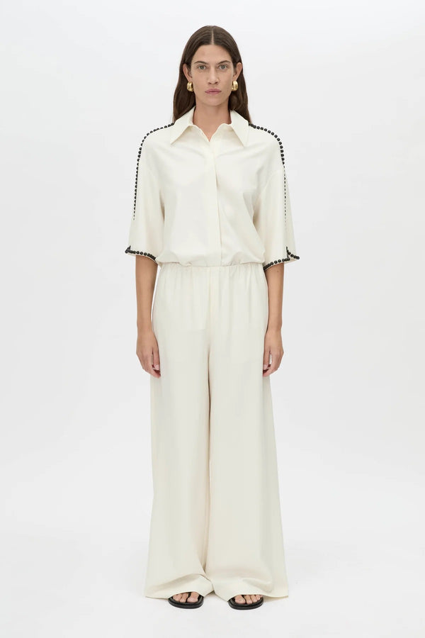 Trevi Shirt by in Cream Camilla and Marc – a cream short-sleeve shirt with hand-sewn bead details and clean tailoring, perfect for polished warm days.
