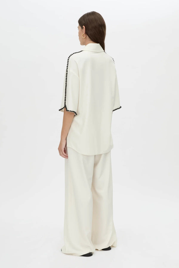Trevi Shirt by in Cream Camilla and Marc – a cream short-sleeve shirt with hand-sewn bead details and clean tailoring, perfect for polished warm days.