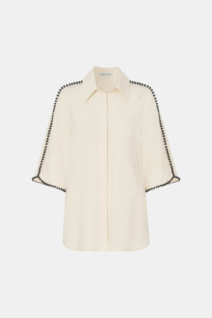 Trevi Shirt by in Cream Camilla and Marc – a cream short-sleeve shirt with hand-sewn bead details and clean tailoring, perfect for polished warm days.