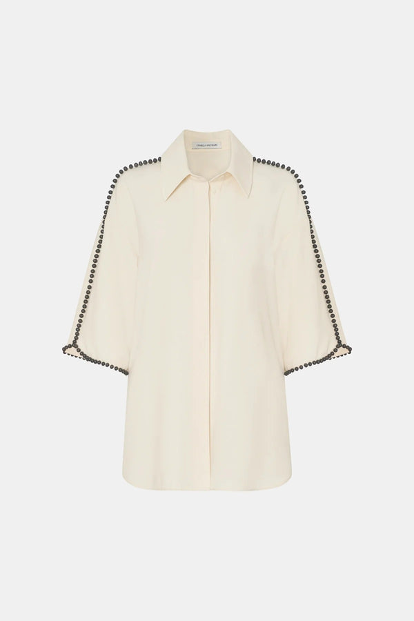 Trevi Shirt by in Cream Camilla and Marc – a cream short-sleeve shirt with hand-sewn bead details and clean tailoring, perfect for polished warm days.