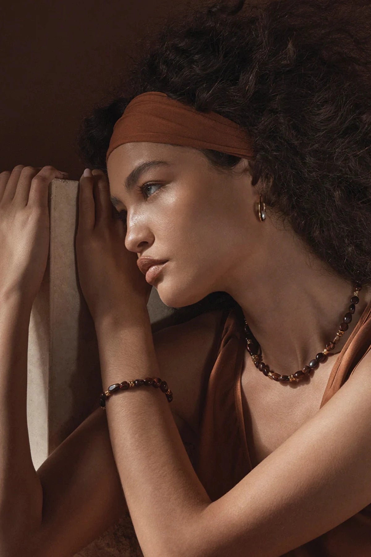 Tuscany Bracelet Gold by Amber Sceats, gold-plated bracelet with Red Tiger’s Eye beads, a trendy piece perfect for chic layering or elegant events.