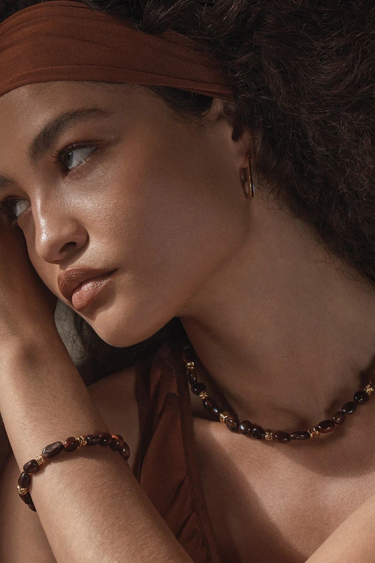 Tuscany Bracelet Gold by Amber Sceats, gold-plated bracelet with Red Tiger’s Eye beads, a trendy piece perfect for chic layering or elegant events.