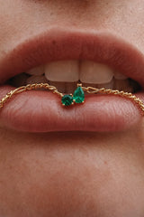 Twin Flame Necklace Emerald by Avant Studio – 18k gold plated sterling silver necklace with emerald cubic zirconia pendant.