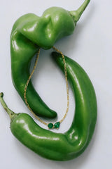 Twin Flame Necklace Emerald by Avant Studio – 18k gold plated sterling silver necklace with emerald cubic zirconia pendant.