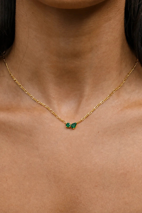 Twin Flame Necklace Emerald by Avant Studio – 18k gold plated sterling silver necklace with emerald cubic zirconia pendant.