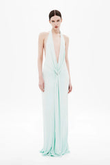 Unity Jersey Dress by Misha, a plunge-neck maxi with soft jersey drape and hardware sash. Perfect for elegant nights and formal occasions.