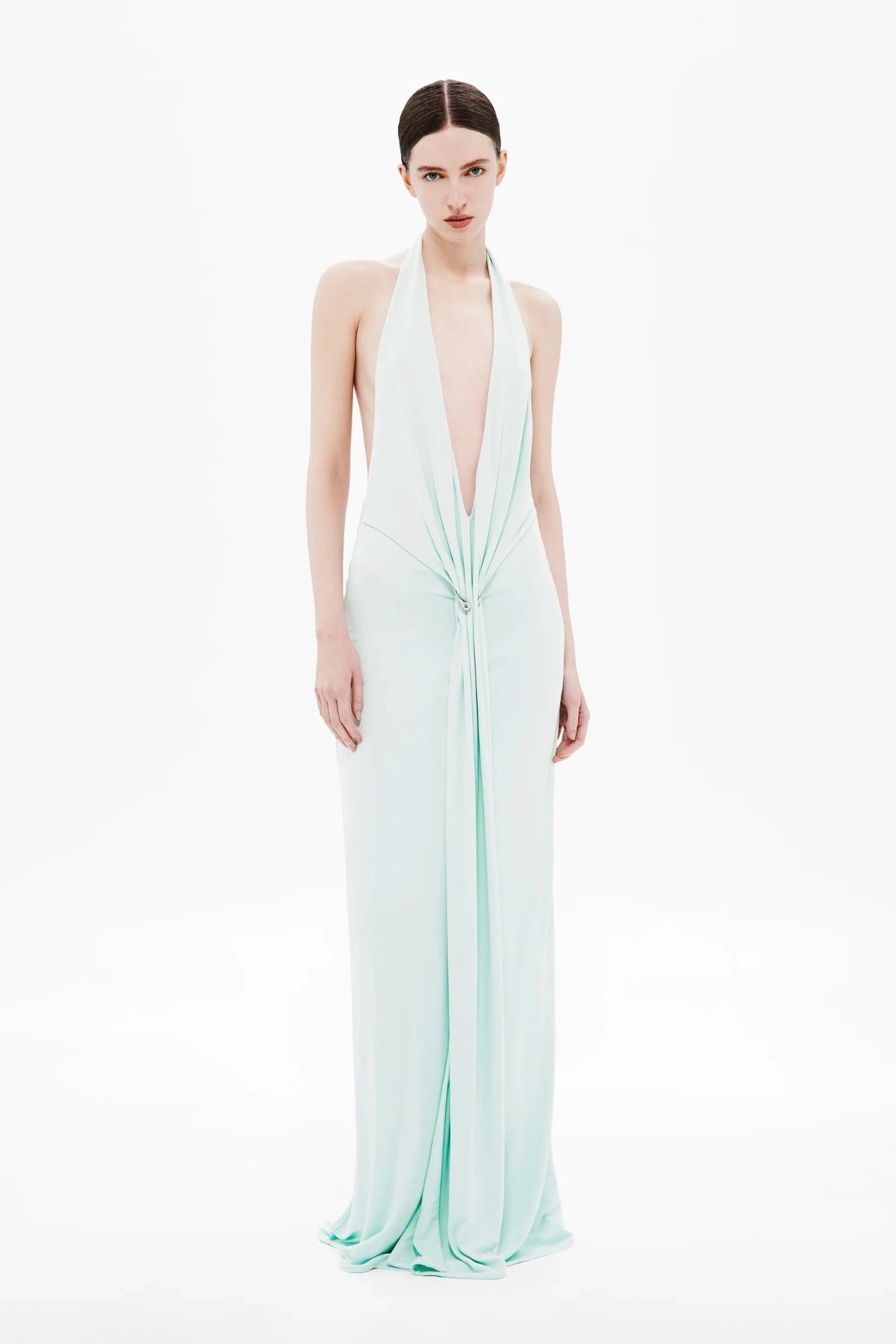 Unity Jersey Dress by Misha, a plunge-neck maxi with soft jersey drape and hardware sash. Perfect for elegant nights and formal occasions.