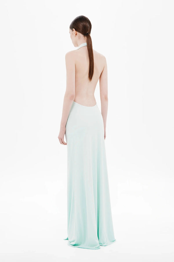 Unity Jersey Dress by Misha, a plunge-neck maxi with soft jersey drape and hardware sash. Perfect for elegant nights and formal occasions.